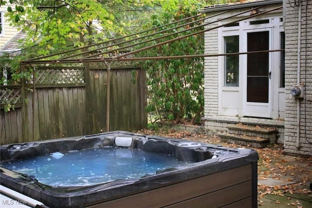 exterior space featuring a hot tub