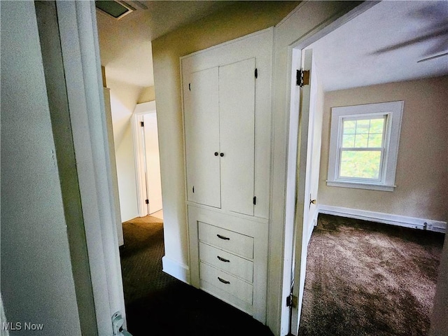 hallway with carpet flooring