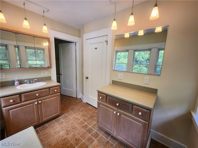 kitchen featuring hanging light fixtures and sink