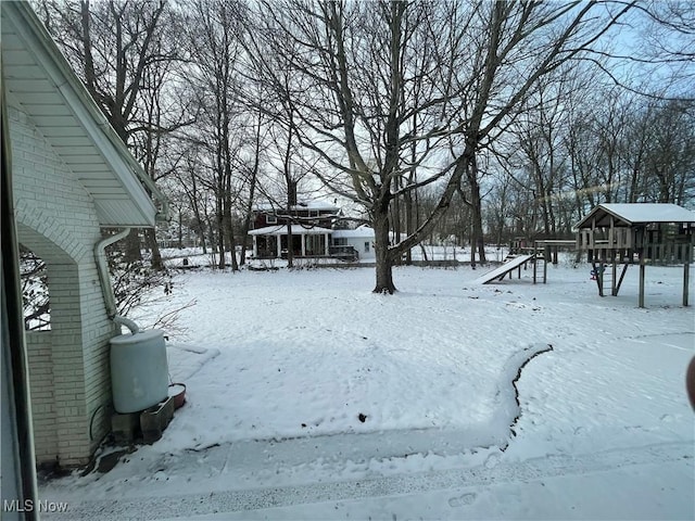 view of yard covered in snow