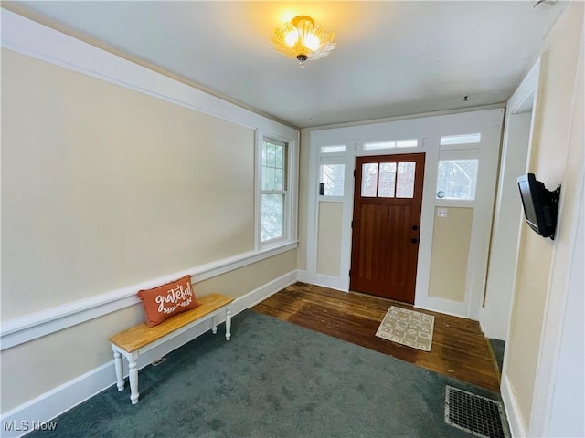 view of carpeted foyer