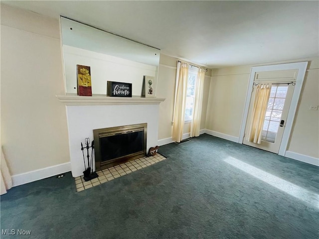 unfurnished living room featuring carpet