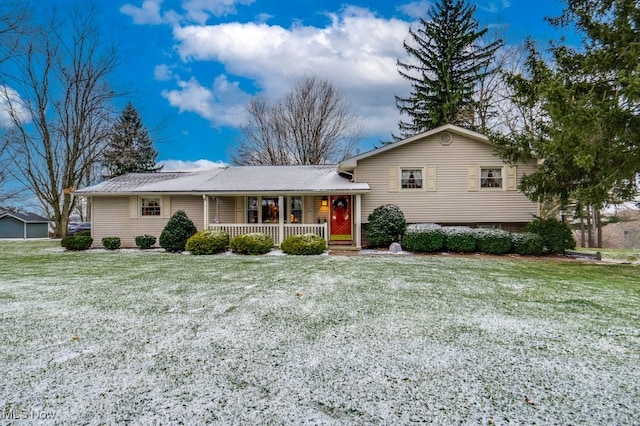 view of front of property with a porch and a front lawn