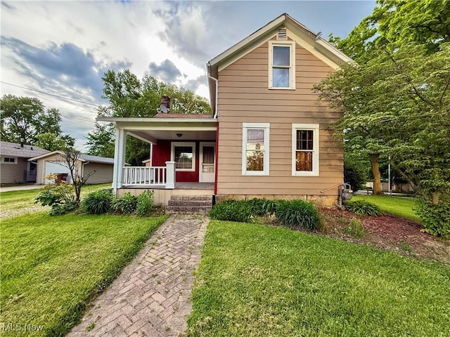 60 Liberty St, Seville, OH 44273 - traditional home featuring a porch and a front lawn