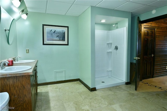 bathroom with a shower and vanity