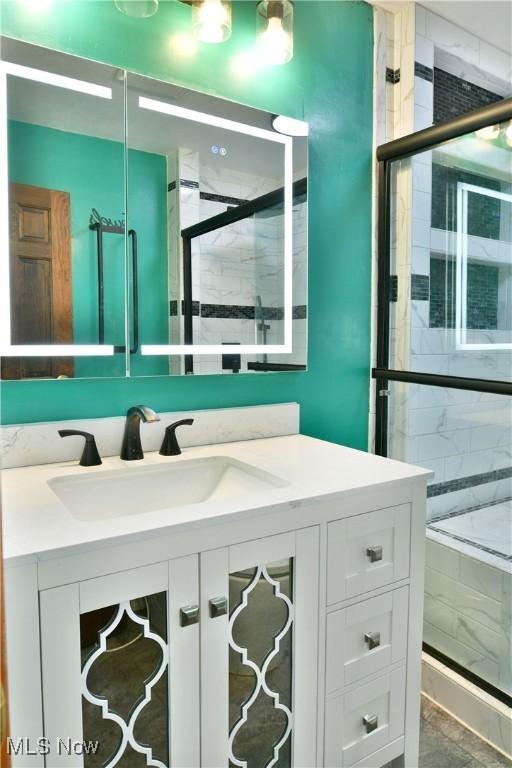 bathroom featuring vanity and walk in shower