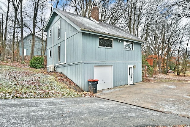 view of side of property featuring a garage