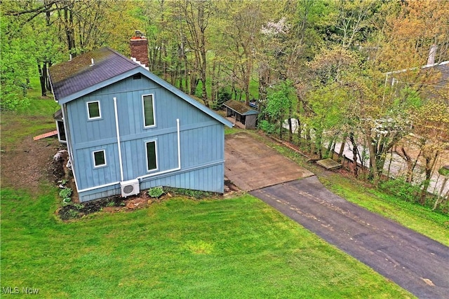 48077 Allegheny Trl, Negley, OH 44441 - exterior space featuring driveway and a wooded view