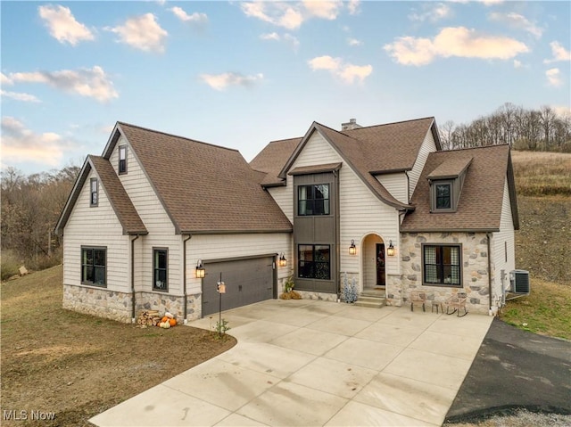 view of front of home featuring central AC and a front yard