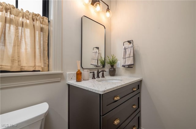 bathroom with vanity and toilet