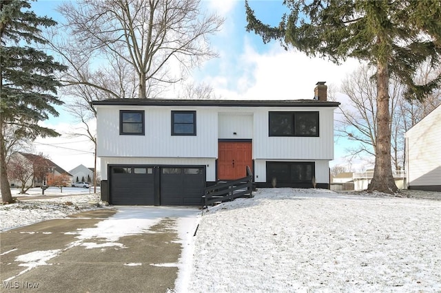 bi-level home featuring a garage