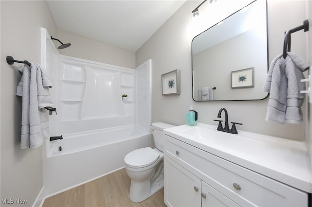 full bathroom featuring vanity, wood-type flooring,  shower combination, and toilet