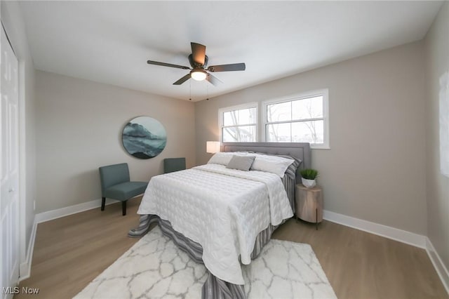 bedroom featuring a closet, hardwood / wood-style flooring, and ceiling fan