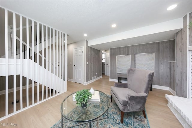 sitting room with light hardwood / wood-style flooring