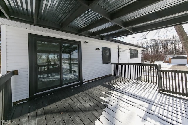 view of snow covered deck