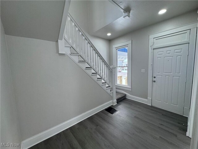 entrance foyer featuring dark wood-type flooring