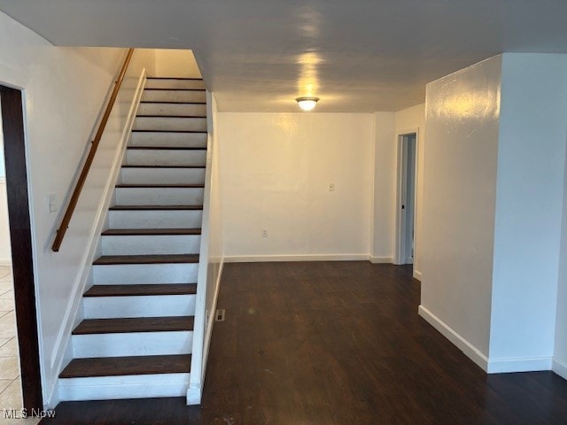 stairway featuring hardwood / wood-style floors