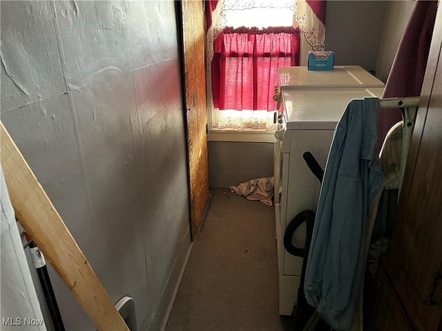 laundry area featuring a healthy amount of sunlight and washing machine and clothes dryer