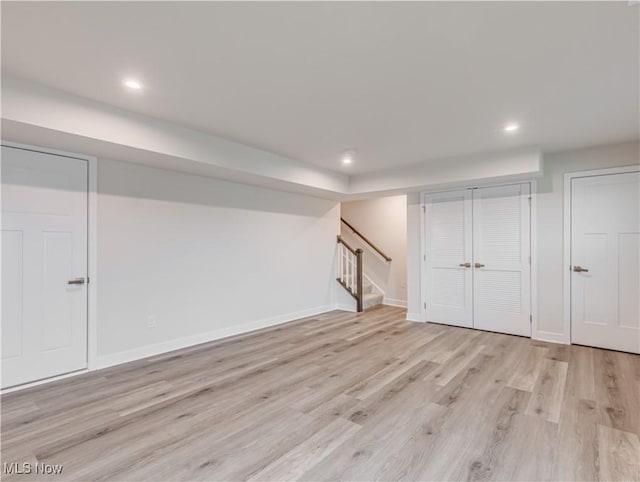 basement featuring light hardwood / wood-style flooring