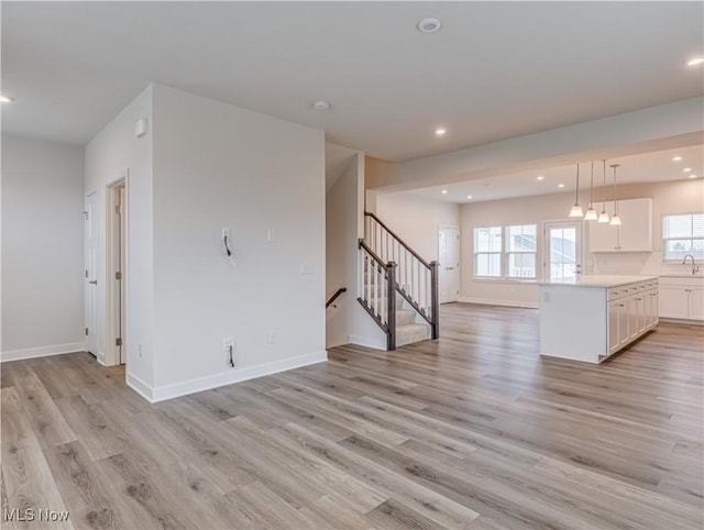 unfurnished living room with light hardwood / wood-style floors