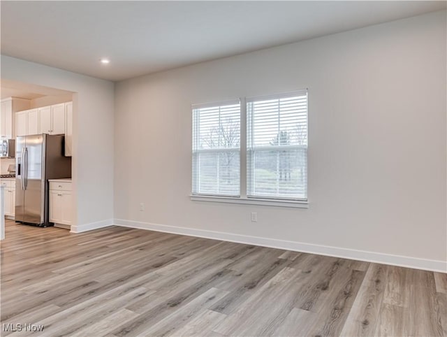 interior space with light hardwood / wood-style flooring