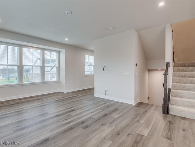 unfurnished living room with light hardwood / wood-style floors