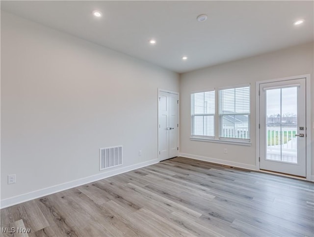 empty room featuring light hardwood / wood-style floors