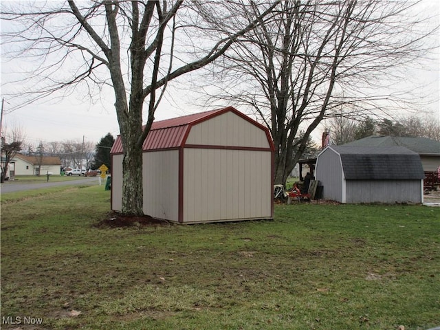 view of outdoor structure with a lawn