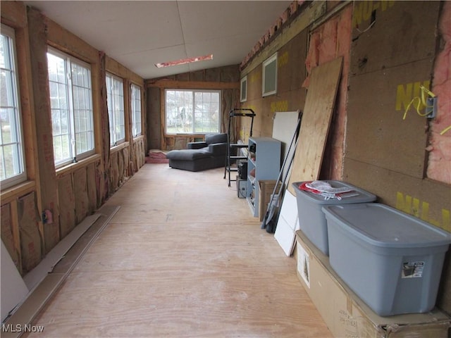 interior space featuring a healthy amount of sunlight and vaulted ceiling