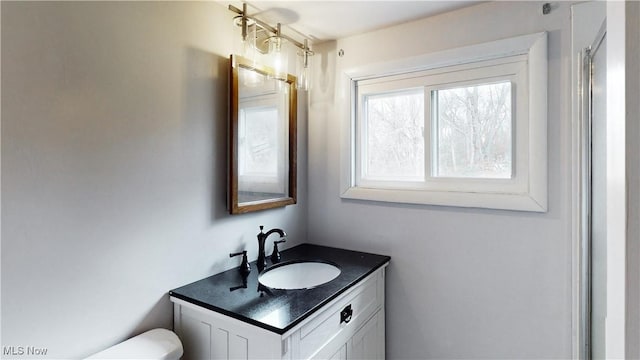 bathroom with vanity and toilet