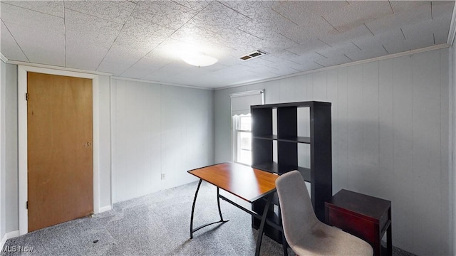 office with crown molding and carpet floors