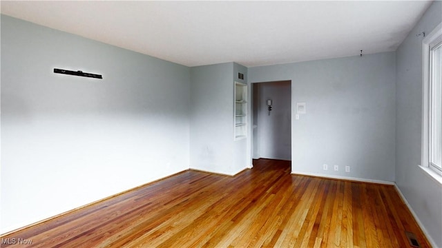 spare room featuring hardwood / wood-style flooring