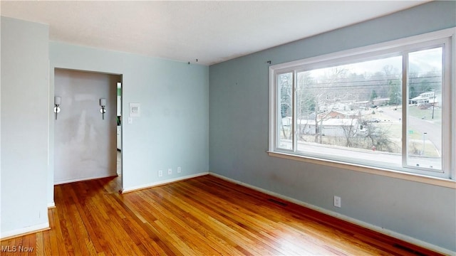 empty room featuring hardwood / wood-style floors