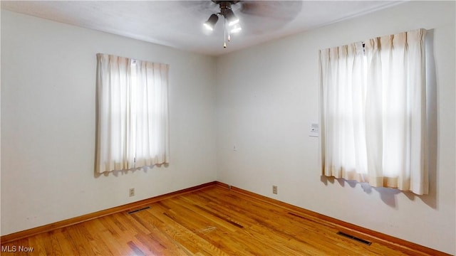 unfurnished room with ceiling fan and light hardwood / wood-style floors