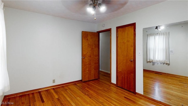 unfurnished bedroom featuring ceiling fan and light hardwood / wood-style flooring