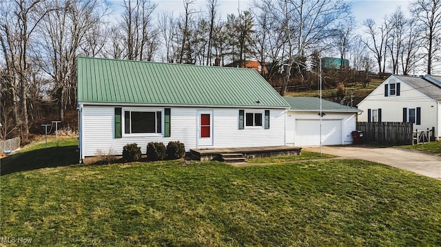 view of front of house with a garage and a front lawn