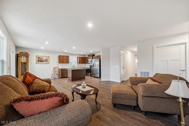 living room with light hardwood / wood-style flooring