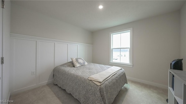 bedroom with light colored carpet