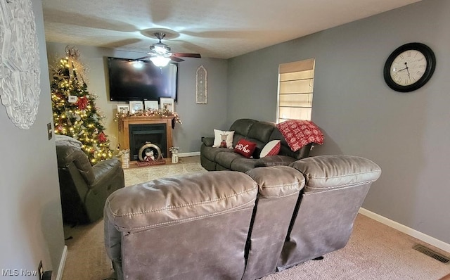 living room with carpet and ceiling fan