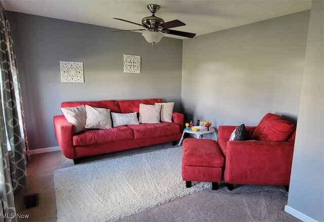 living room featuring carpet flooring and ceiling fan