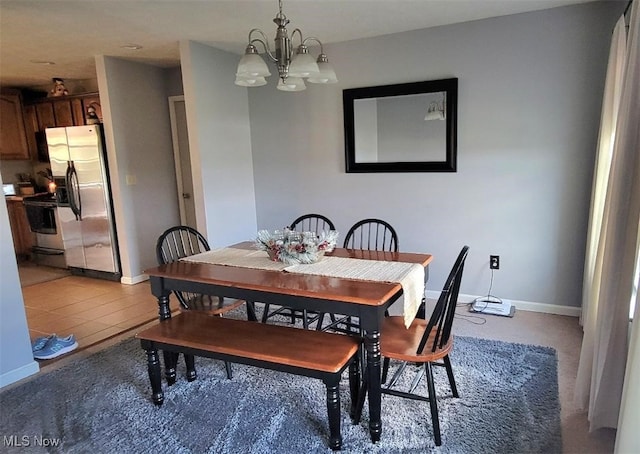 dining area featuring a notable chandelier