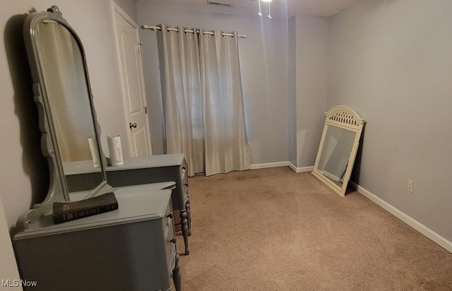 interior space featuring light carpet and heating unit