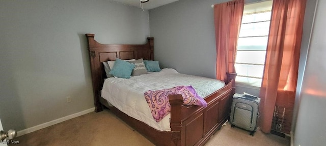 bedroom featuring light colored carpet