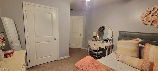 bedroom with a closet and light colored carpet