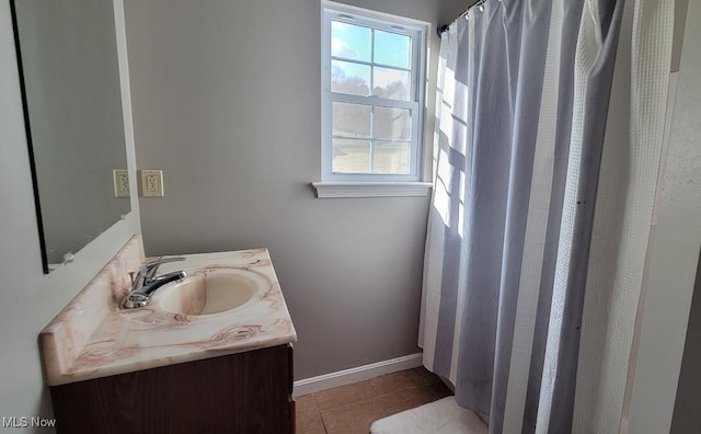 bathroom with tile patterned floors and vanity