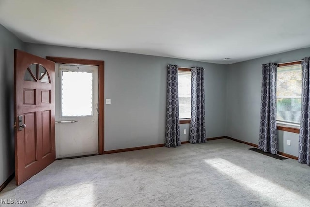 view of carpeted foyer