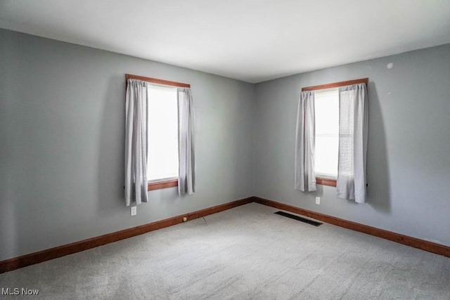 unfurnished room featuring carpet floors