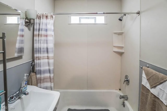 bathroom with sink and shower / tub combo