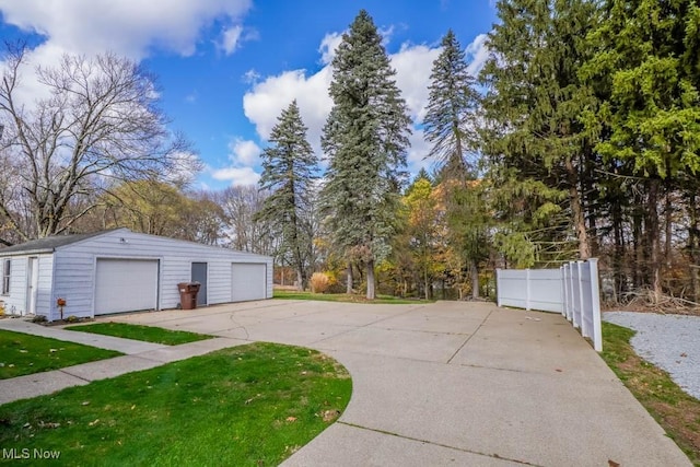 exterior space with an outbuilding and a garage