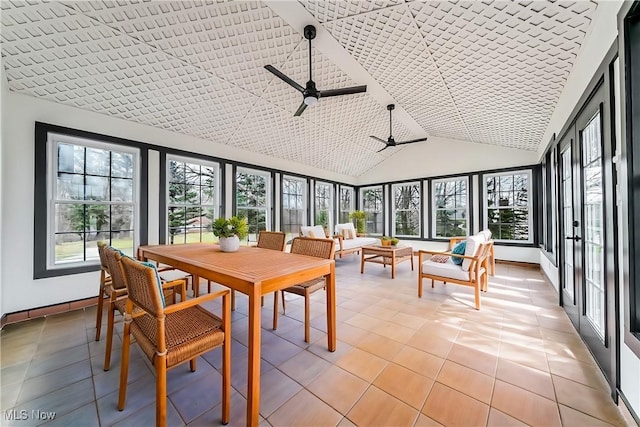 sunroom featuring ceiling fan and lofted ceiling